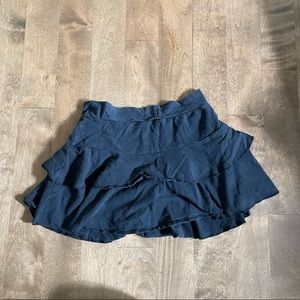 - Black pleated mini skort